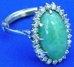 Cabochon Jade and Diamond Ring. 